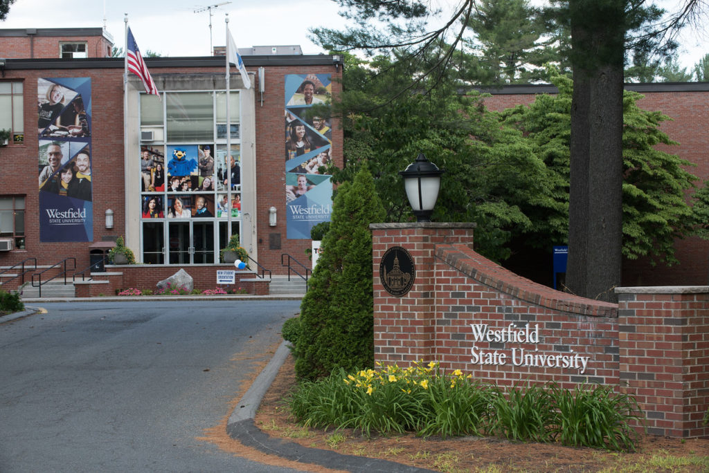 The entrance to Westfield State with Parenzo Hall peeking out in the foreground. Image credit- Westfield State University. 