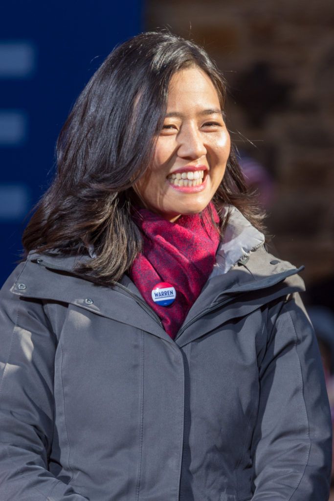 Michelle Wu, Boston City Council Member, wears a button supporting Elizabeth Warren for President.