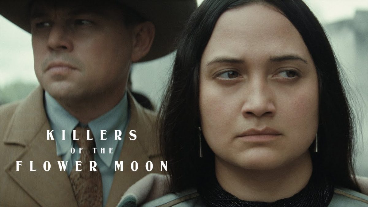 Killers of the Flower Moon promotional image featuring Lily Gladstone and Leonardo DiCaprio as Mollie and Ernest Burkhart, respectively.